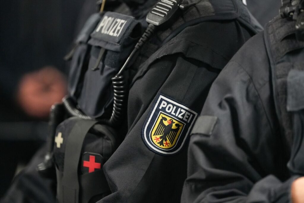German police officers searching a wooded area in Berlin