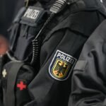 German police officers searching a wooded area in Berlin