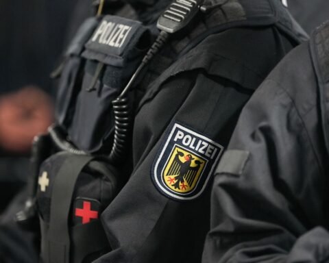 German police officers searching a wooded area in Berlin