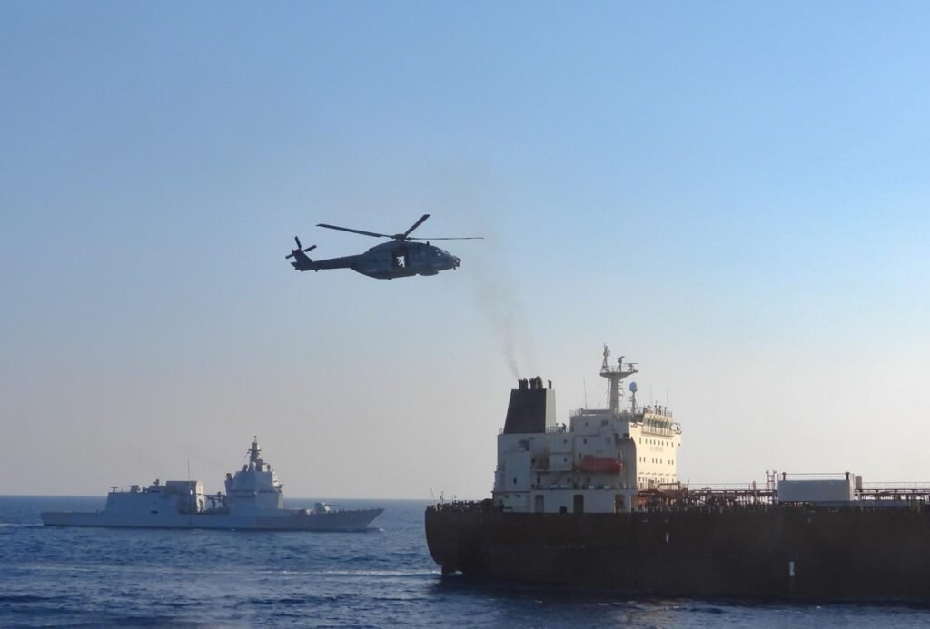 Italian military helicopter flying above the sanctioned oil tanker Toa Payoh during an EU inspection in the Mediterranean Sea