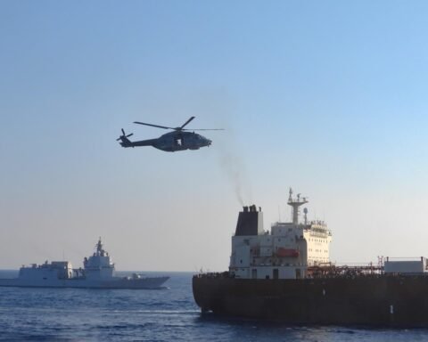 Italian military helicopter flying above the sanctioned oil tanker Toa Payoh during an EU inspection in the Mediterranean Sea