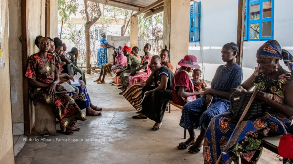 Women and children waiting for care at a clinic in South Sudan