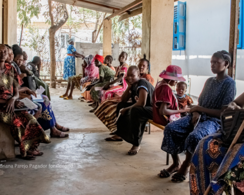 Women and children waiting for care at a clinic in South Sudan